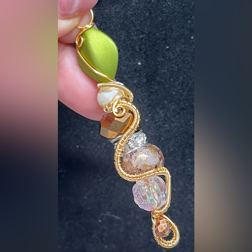 Gold and copper Pandora like bead made into a unique wrapped pendant dangle
